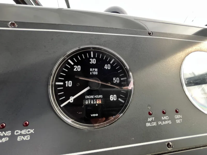 Slide: The Image of Instrument panel of a 2000 Tiara Yachts 3100 Open, showing RPM gauge and engine hours. - 15