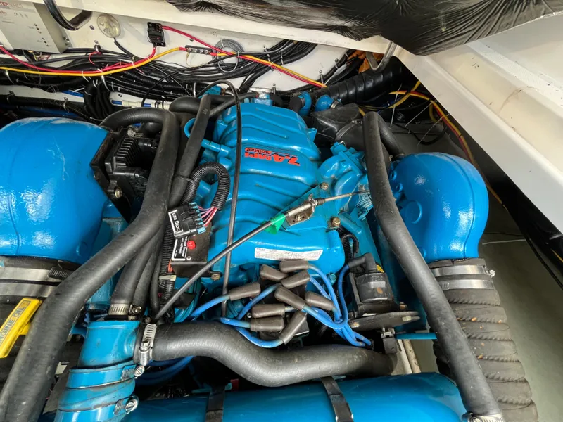 Slide: The Image of Engine compartment of a 2000 Tiara Yachts 3100 Open, featuring a blue marine engine. - 17