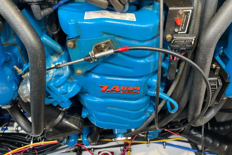 Slide: The Image of Engine of a 2000 Tiara Yachts 3100 Open, featuring a blue 7.4 MPI motor. - 18