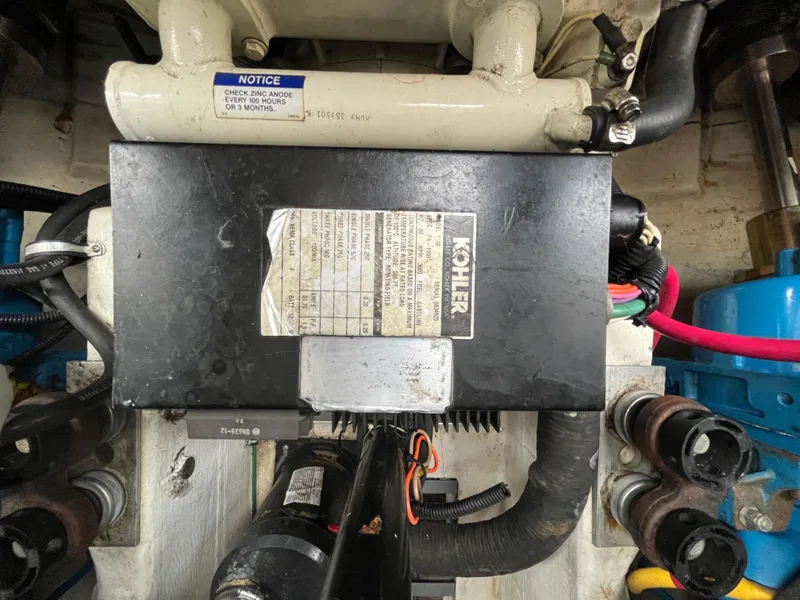 Slide: The Image of Engine compartment of a 2000 Tiara Yachts 3100 Open, featuring a Kohler generator. - 23