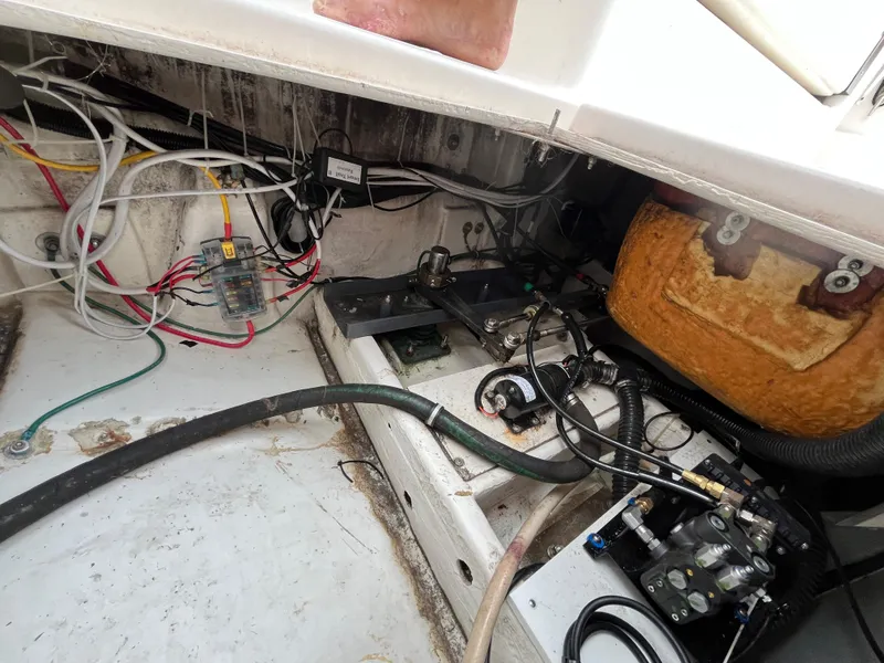 Slide: The Image of Engine compartment of a 2000 Tiara Yachts 3100 Open, showing wiring and mechanical components. - 32
