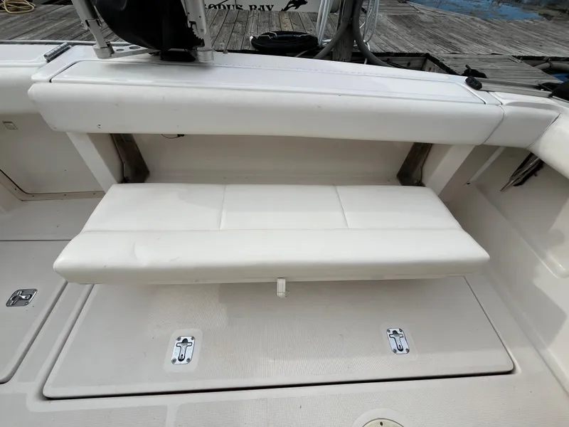 Slide: The Image of Tiara Yachts 3100 Open 2000 model, featuring a white cushioned bench seat on deck. - 33