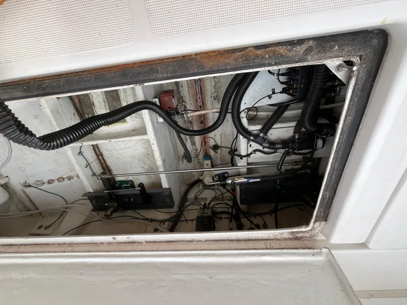 Slide: The Image of Engine compartment of a 2000 Tiara Yachts 3100 Open, showing wiring and components. - 37