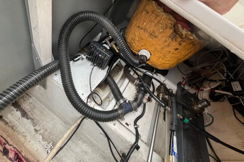 Slide: The Image of Boat engine compartment of a 2000 Tiara Yachts 3100 Open, showing wiring and hoses. - 38