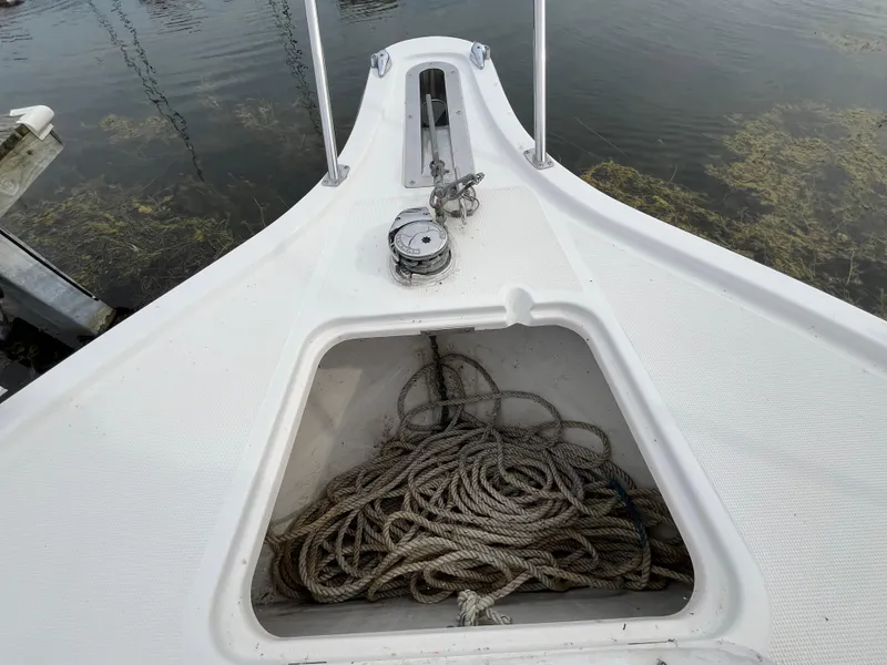 Slide: The Image of Bow of 2000 Tiara Yachts 3100 Open with anchor rope storage. - 4