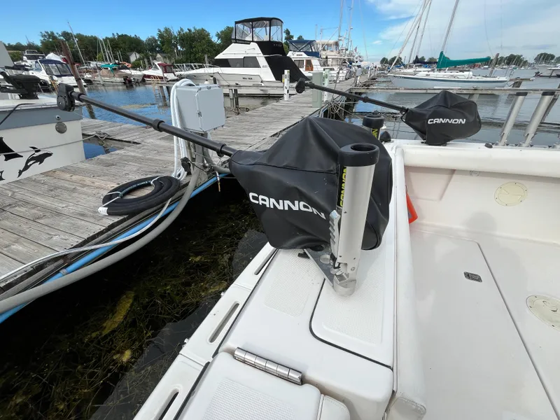 Slide: The Image of Tiara Yachts 3100 Open 2000 model docked with fishing equipment, marina background. - 43