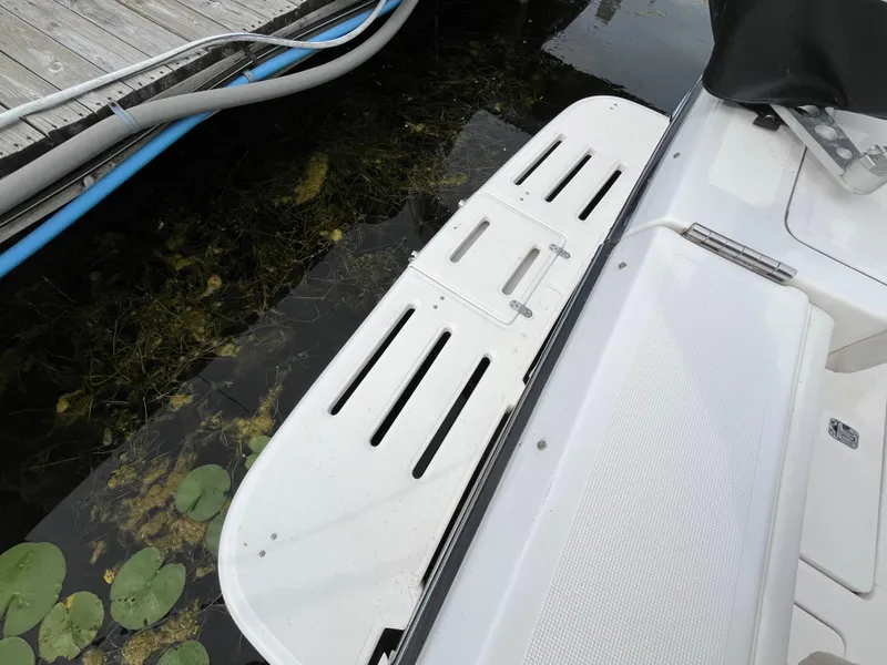 Slide: The Image of Swim platform of a 2000 Tiara Yachts 3100 Open near a dock. - 44