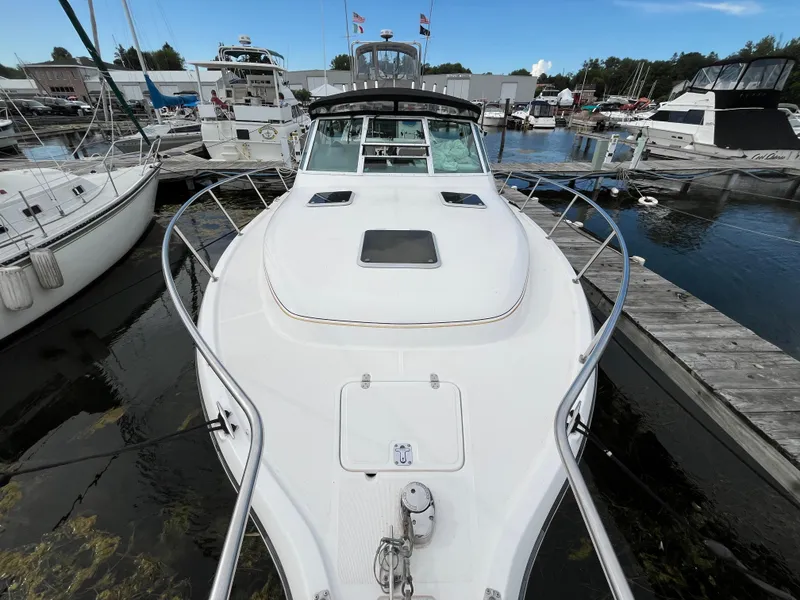 Slide: The Image of 2000 Tiara Yachts 3100 Open docked at marina, front view. - 5