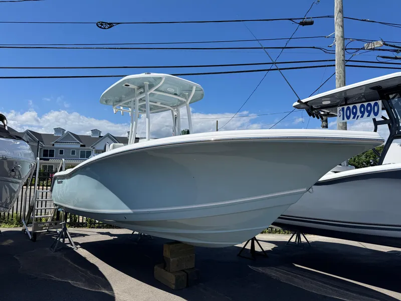 Slide: The Image of 2025 Tidewater 220 LXF boat displayed outdoors, priced at $109,990. - 0
