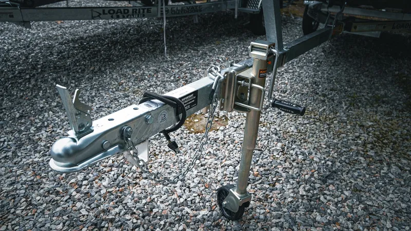Slide: The Image of Trailer hitch and jack stand on gravel, G3 Gator Tough 1448 LW, 2025 model. - 10