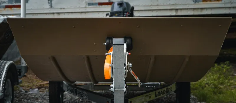 Slide: The Image of 2025 G3 Gator Tough 1448 LW boat on trailer, rear view, outdoors. - 11