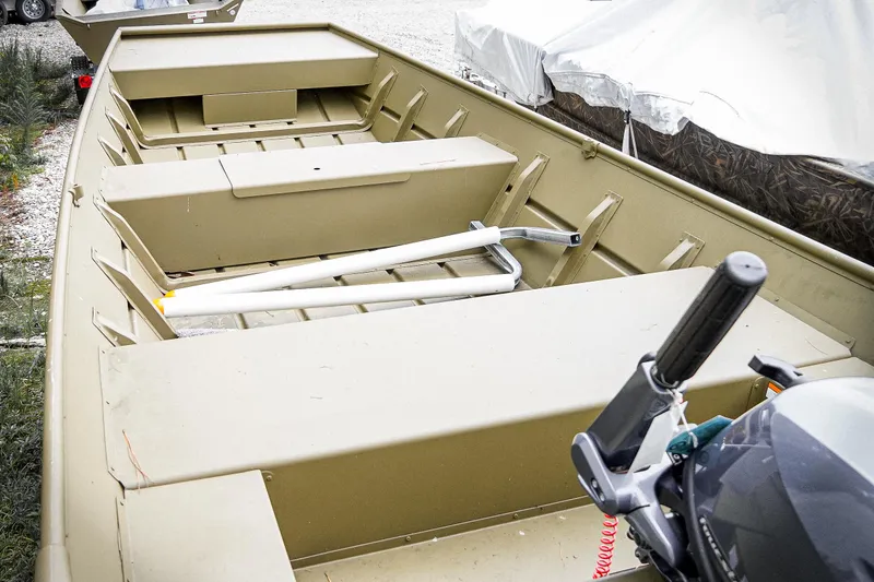 Slide: The Image of 2025 G3 Gator Tough 1448 LW boat interior with motor and storage compartments. - 5