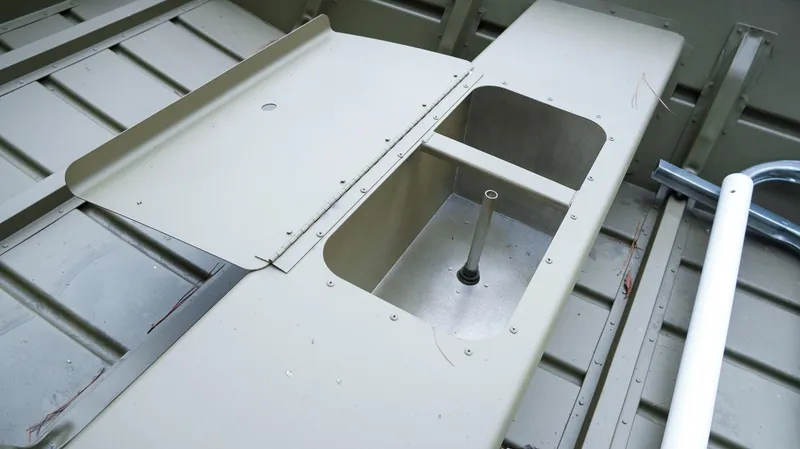 Slide: The Image of Interior view of 2025 G3 Gator Tough 1448 LW boat, showcasing storage compartment. - 6