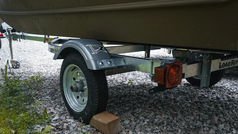 Slide: The Image of Trailer of 2025 G3 Gator Tough 1448 LW boat on gravel. - 9