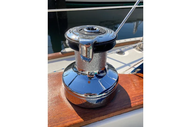Slide: The Image of Chrome winch on 1982 Sabre 30 sailboat deck, reflecting sunlight. - 13