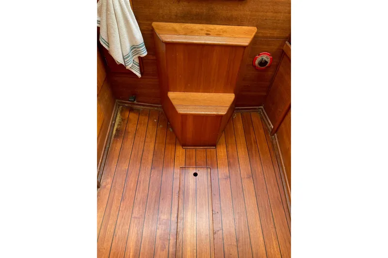 Slide: The Image of 1982 Sabre 30 interior with wooden flooring and cabinetry. - 19