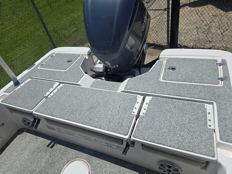 Slide: The Image of 2017 Sea Fox 240 Viper boat deck with Yamaha outboard motor, featuring storage compartments. - 12