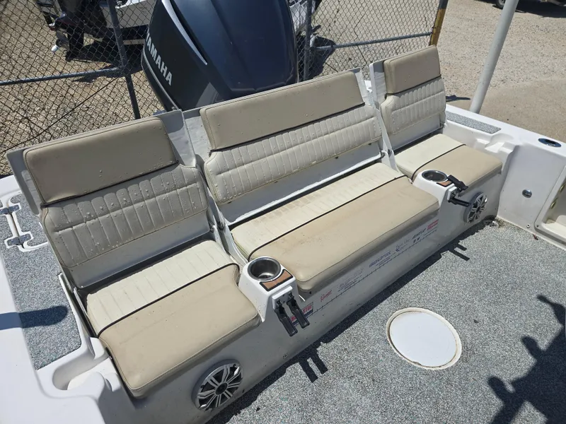 Slide: The Image of 2017 Sea Fox 240 Viper boat seating with cup holders and Yamaha engine in background. - 13