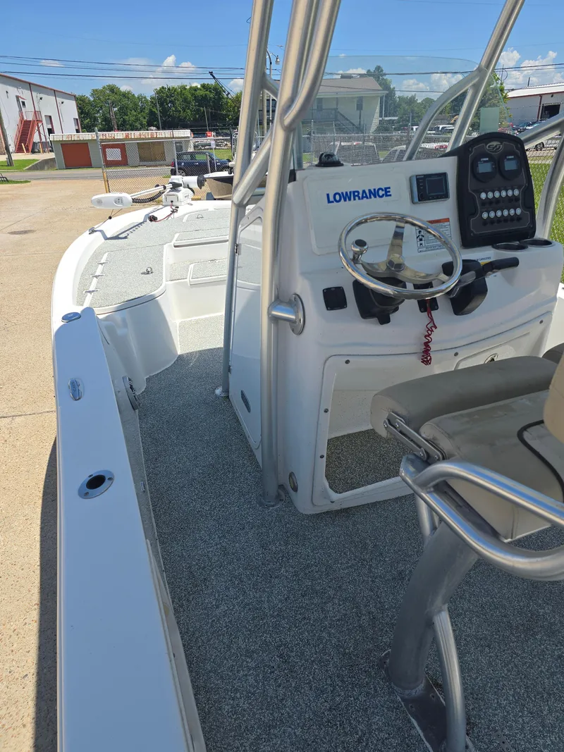 Slide: The Image of 2017 Sea Fox 240 Viper boat with Lowrance navigation system, docked outdoors. - 15