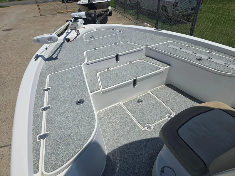 Slide: The Image of 2017 Sea Fox 240 Viper boat deck with storage compartments and measuring ruler. - 7
