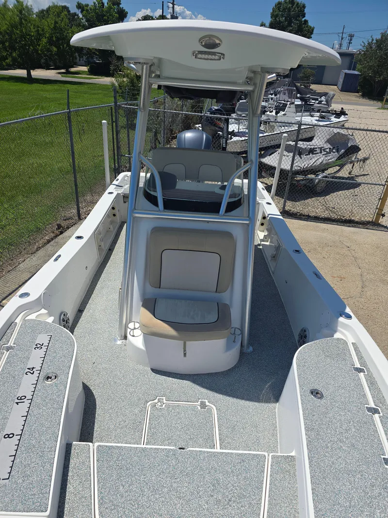 Slide: The Image of 2017 Sea Fox 240 Viper boat with center console and seating, parked outdoors. - 8