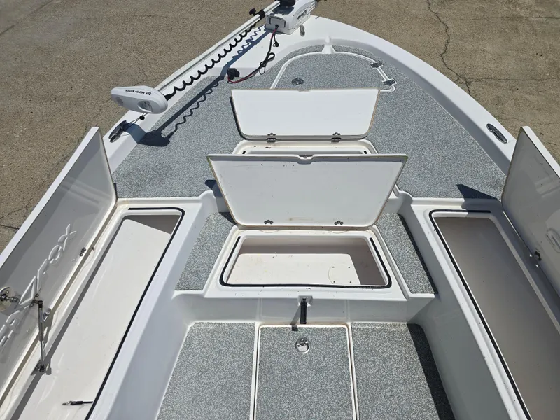 Slide: The Image of 2017 Sea Fox 240 Viper boat deck with open storage compartments and trolling motor. - 9