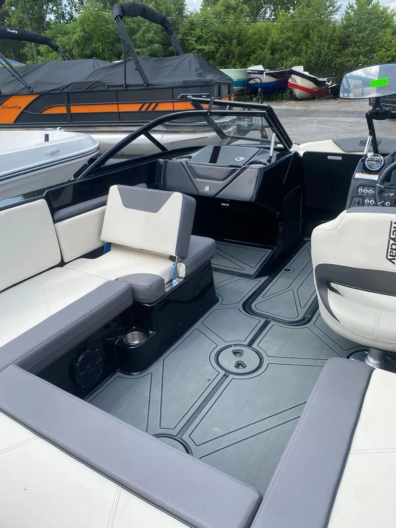Slide: The Image of 2025 Heyday WTSurf boat interior with modern seating and sleek design. - 20