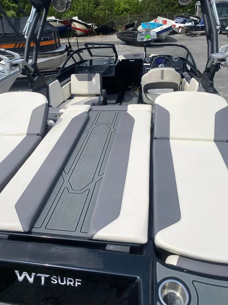Slide: The Image of 2025 Heyday WTSurf boat interior with spacious seating and modern design. - 26