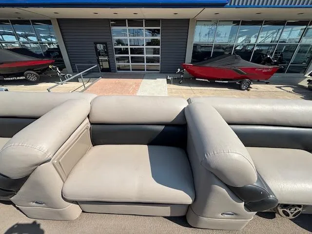 Slide: The Image of Luxurious seating on 2009 Premier 225 Grand Majestic pontoon boat, with showroom backdrop. - 10