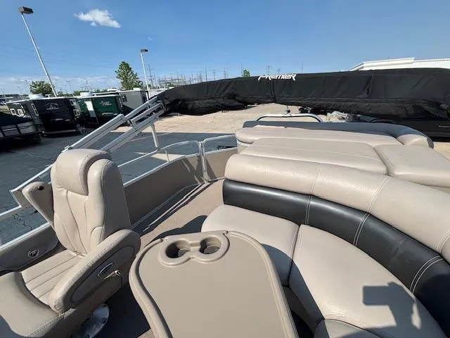 Slide: The Image of 2009 Premier 225 Grand Majestic pontoon boat with beige seating and cup holders. - 13