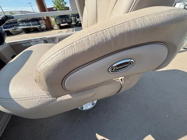 Slide: The Image of Beige Flexsteel seat in 2009 Premier 225 Grand Majestic boat, showcasing armrest detail. - 15