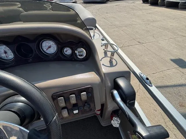 Slide: The Image of Dashboard of a 2009 Premier 225 Grand Majestic boat with gauges and controls. - 21
