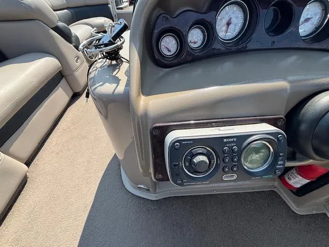 Slide: The Image of Interior dashboard of a 2009 Premier 225 Grand Majestic boat with Sony stereo system. - 23