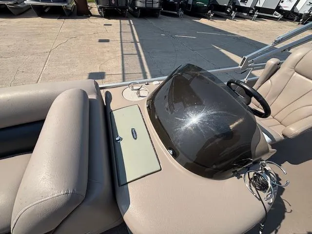 Slide: The Image of 2009 Premier 225 Grand Majestic boat dashboard with steering wheel and seating. - 25