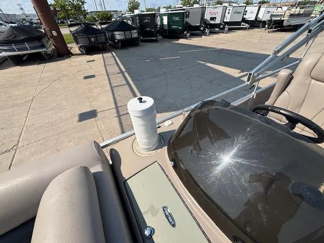 Slide: The Image of 2009 Premier 225 Grand Majestic boat interior with docked pontoons in background. - 27