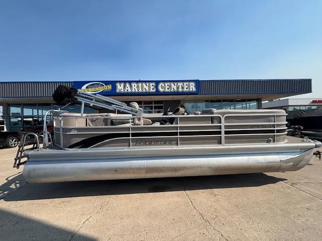 Slide: The Image of 2009 Premier 225 Grand Majestic pontoon boat at a marine center. - 5
