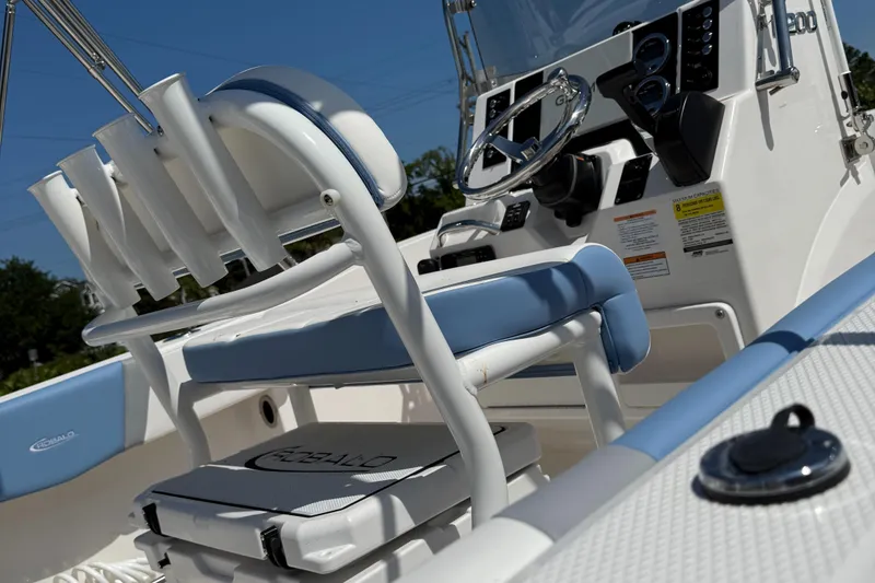 Slide: The Image of 2025 Robalo R200 Center Console boat interior with steering wheel and seating. - 2