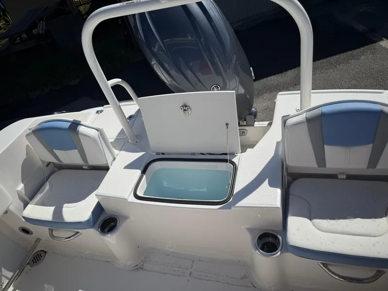 Slide: The Image of 2025 Robalo R200 Center Console boat interior with seating and storage compartments. - 5