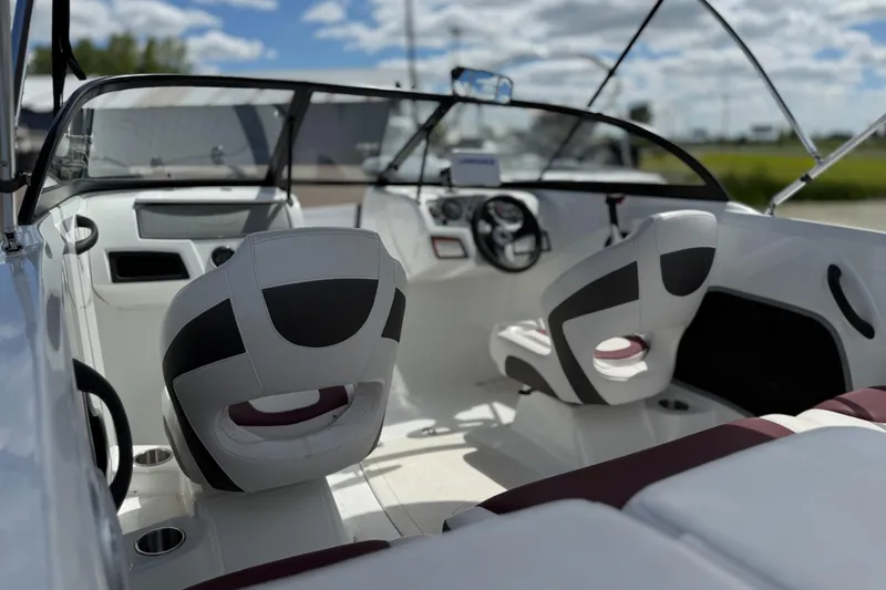 Slide: The Image of Interior of a 2018 Tahoe 450TF boat with modern seating and dashboard. - 1