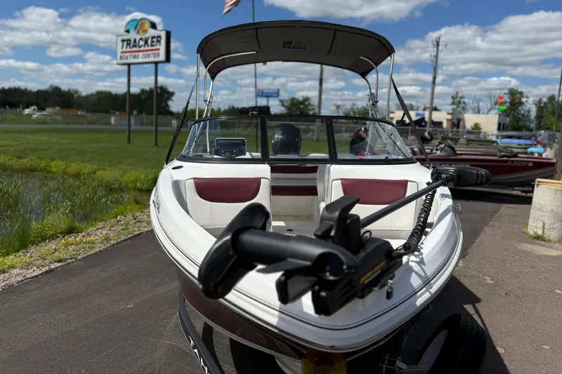 Slide: The Image of 2018 Tahoe 450TF boat at Tracker Boating Center, sunny day, outdoor display. - 4