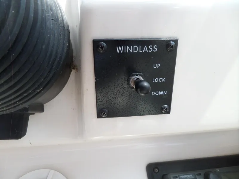 Slide: The Image of Windlass control panel on 1995 Sea Ray 250 Sundancer boat, featuring up, lock, and down options. - 20