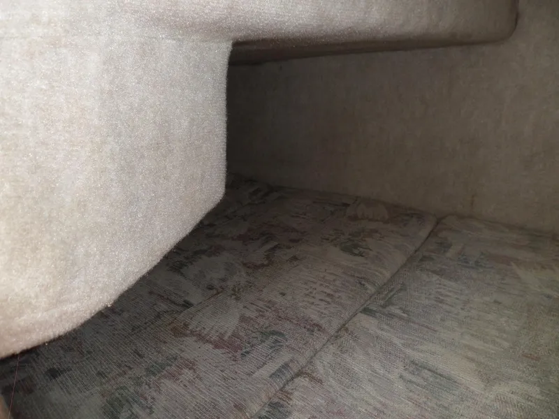 Slide: The Image of Interior cabin of 1995 Sea Ray 250 Sundancer with beige upholstery. - 35