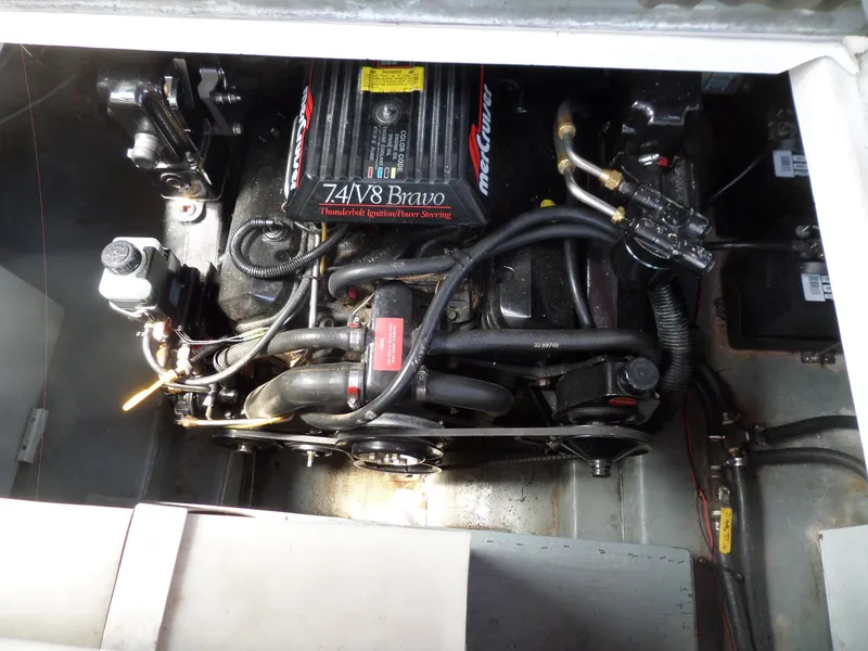 Slide: The Image of Engine compartment of a 1995 Sea Ray 250 Sundancer with 7.4L V8 Bravo engine. - 39