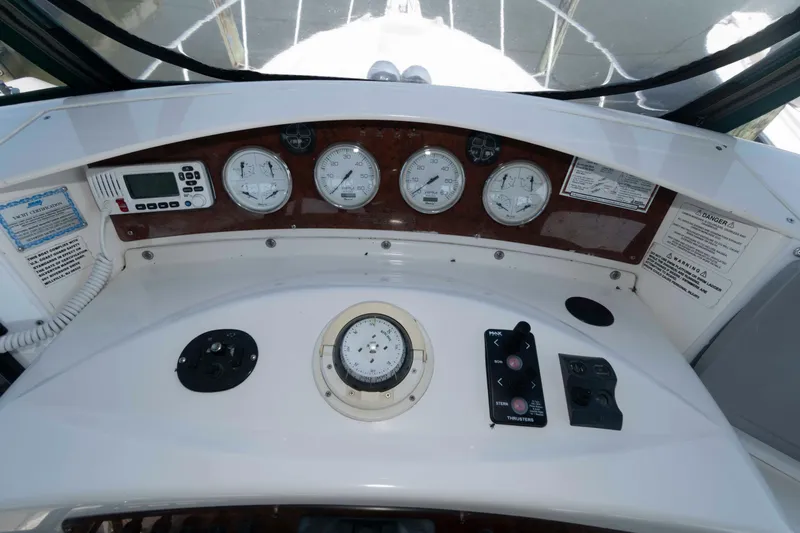 Slide: The Image of 2004 Silverton 34 Convertible dashboard with gauges and controls. - 11
