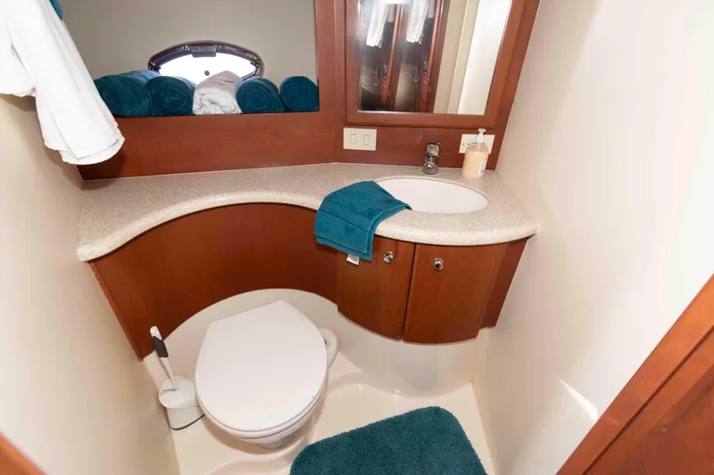 Slide: The Image of Bathroom interior of 2004 Silverton 34 Convertible yacht with sink and toilet. - 22