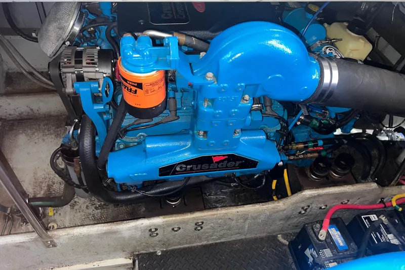 Slide: The Image of Engine compartment of a 2004 Silverton 34 Convertible with a blue Crusader engine. - 25