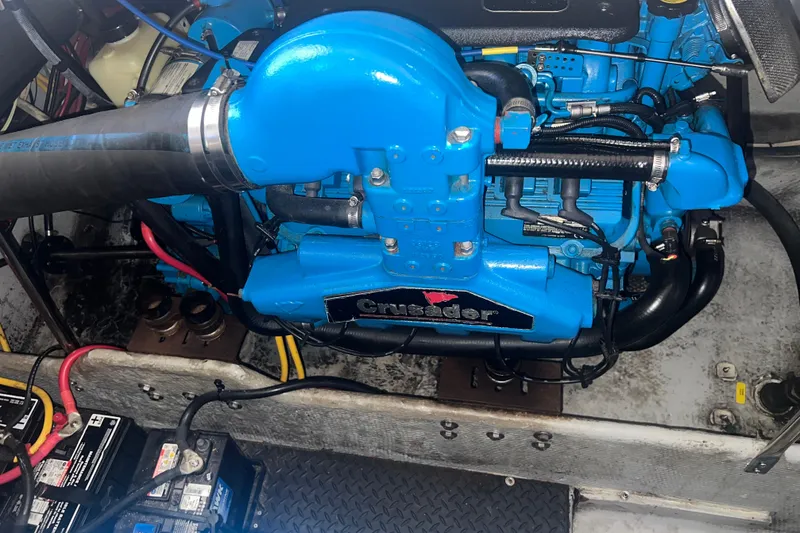 Slide: The Image of Engine compartment of a 2004 Silverton 34 Convertible with a blue Crusader engine. - 26