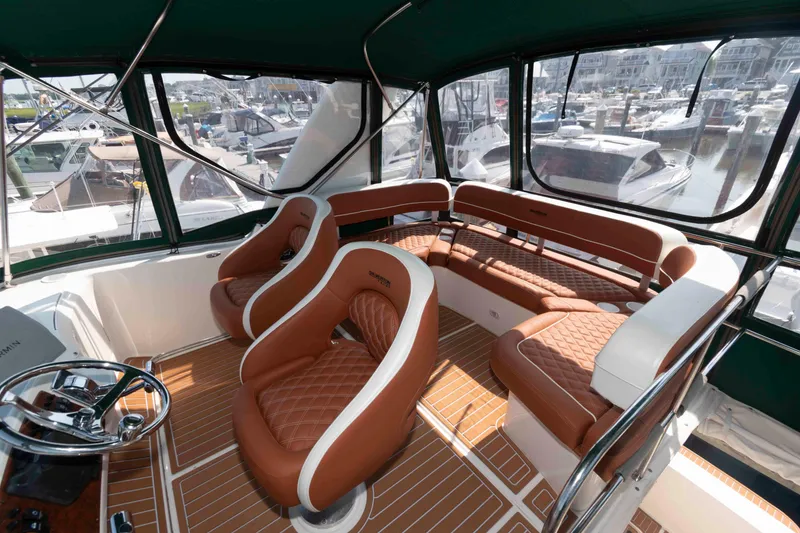 Slide: The Image of Luxurious interior of a 2004 Silverton 34 Convertible yacht with leather seating. - 5