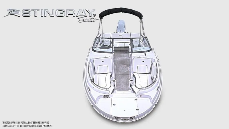 Slide: The Image of 2025 Stingray 231 DC boat, top view, sleek design, spacious seating, white exterior. - 3