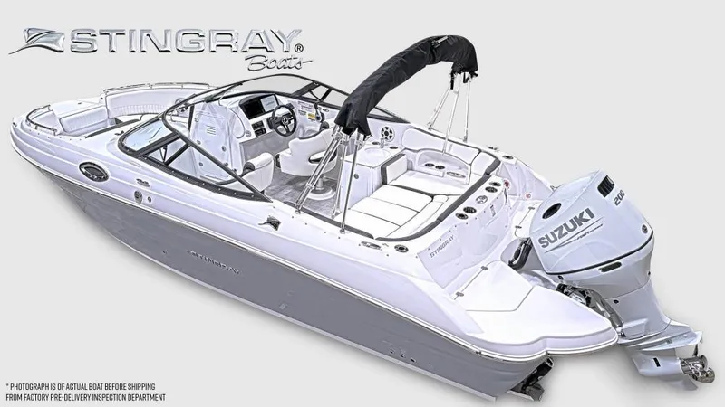 Slide: The Image of 2025 Stingray 231 DC boat with Suzuki engine, sleek design, and spacious seating. - 4